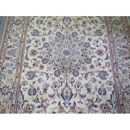 265 - A hand knotted woollen fine Kashan rug, 2.4m x 1.55m, in good condition