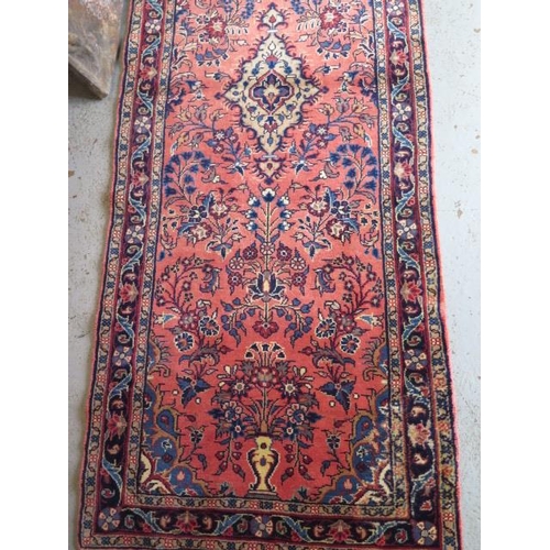 260 - A hand knotted woollen Sarough rug, 3.9m x .80m in good condition