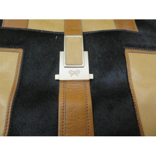 504 - A Anya Hindmarch, a tricolour leather bag, 40cm wide, some usage but generally good condition