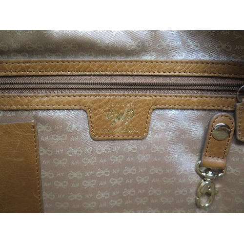 504 - A Anya Hindmarch, a tricolour leather bag, 40cm wide, some usage but generally good condition