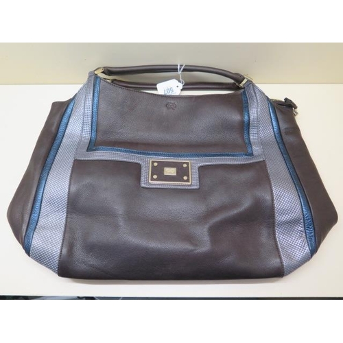 502 - A Anya Hindmarch brown, grey and blue leather bag with inside pockets, 40cm wide, some small amount ... 