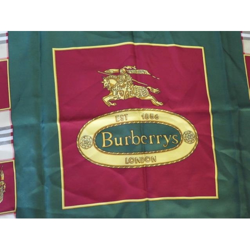 496 - A Burberrys silk scarf, c.1980, detailed with classic check and equestrian knight against a green gr... 