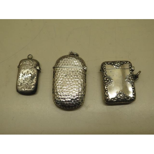 610 - Three silver vesta cases, largest 6cm, total weight approx 1.8 troy oz, smallest has small dents and... 