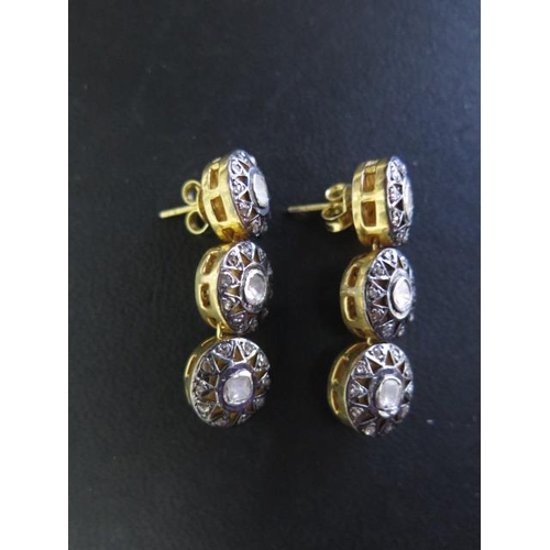 804 - A pair of gilt three stone rough cut diamond earrings, 3.5cm long, in good condition