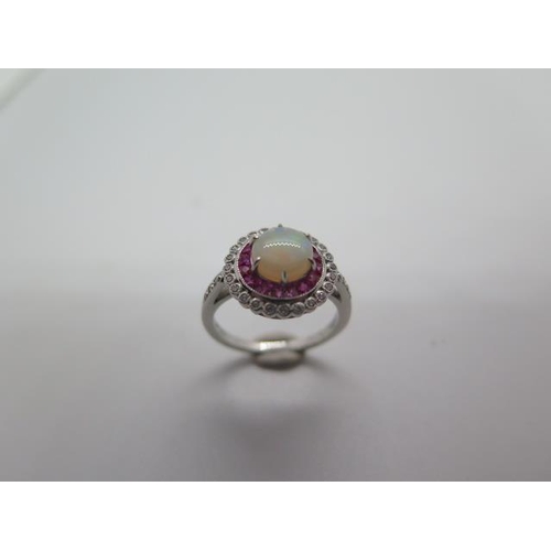 794 - A platinum opal, ruby and diamond ring, hallmarked, size M, head approx 12mm, approx 5 grams, in goo... 