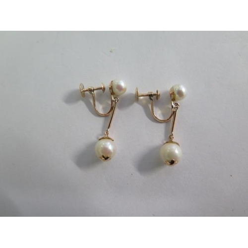 778 - A 14ct yellow gold pearl drop earrings, 18mm drop, approx 3.4 grams, in good condition