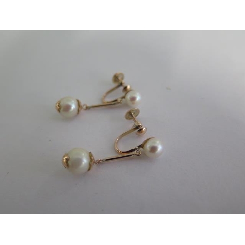 778 - A 14ct yellow gold pearl drop earrings, 18mm drop, approx 3.4 grams, in good condition