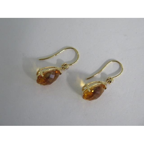 791 - A 18ct yellow gold citrine and diamond drop earrings, marked 750, and hallmarked, 15mm in length, ap... 