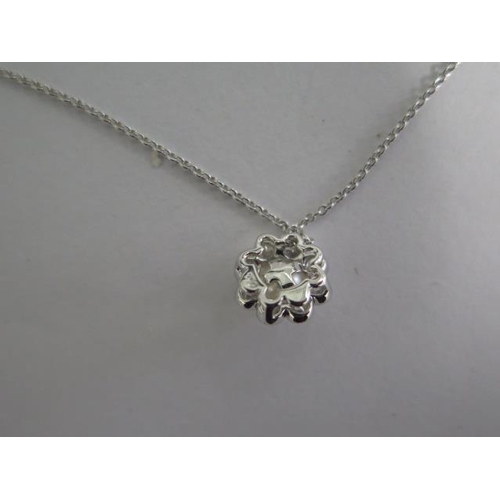 796 - A 18ct white gold diamond and pearl pendant on an 18ct hallmarked gold chain, 40cm long, total diamo... 