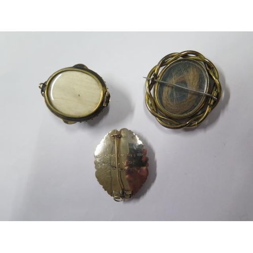 806 - A gold enamel mourning brooch, tests to approx 9ct, approx 13 grams and two other gilt mourning broo... 