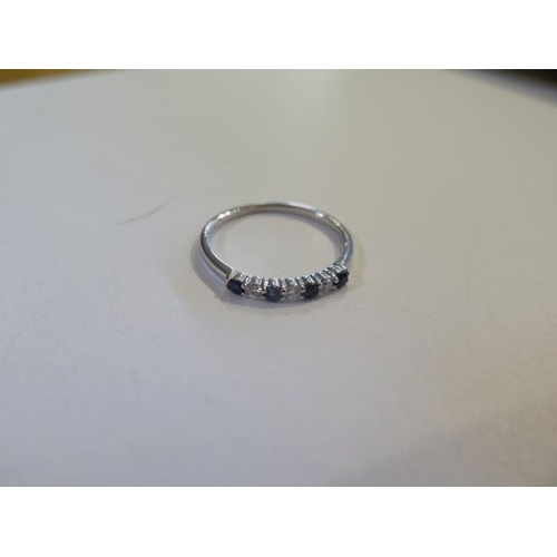 802 - A hallmarked white gold diamond and sapphire seven stone ring, size J, approx 0.8 grams, in good con... 