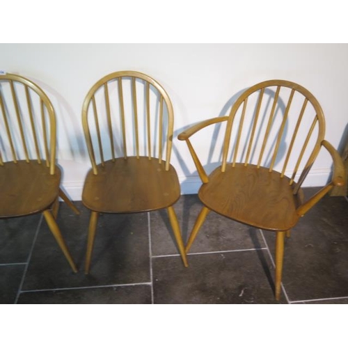 104 - A set of four blonde Ercol Windsor chairs, two being carvers, in clean original condition