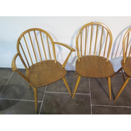 104 - A set of four blonde Ercol Windsor chairs, two being carvers, in clean original condition