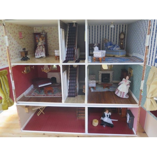 1050 - A large dolls house modelled on an Edwardian four floor house with furniture and accessories and ele... 