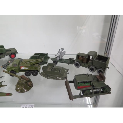 1058 - A collection of diecast and others military vehicles, all play worn and some repairs