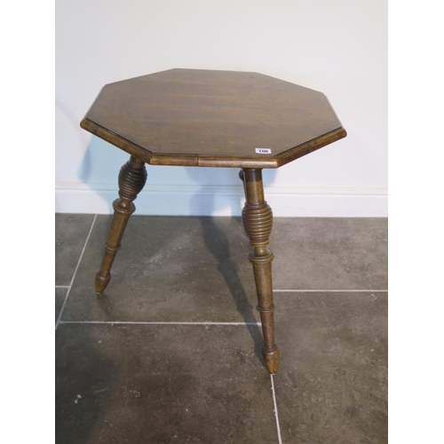 106 - A 19th century walnut octagonal top cricket table on turned legs, 62cm tall x 61 cm