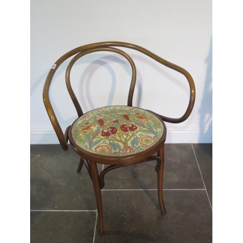 107 - A Thonet type bentwood open armchair, 78cm tall x 63cm wide