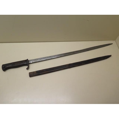 1072 - An 1898 German bayonet with leather scabbard, general pitting and age related wear, blade length 52c... 