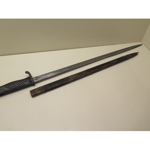 1072 - An 1898 German bayonet with leather scabbard, general pitting and age related wear, blade length 52c... 