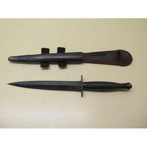 1073 - A 3rd pattern fighting knife with a leather scabbard, blade length 17.5cm, generally good condition,... 