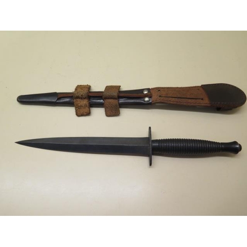 1073 - A 3rd pattern fighting knife with a leather scabbard, blade length 17.5cm, generally good condition,... 