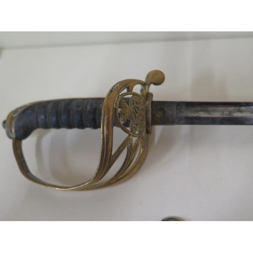 1074 - A Victorian naval sword and scabbard, sword length 89cm, some pitting and wear consistent with age