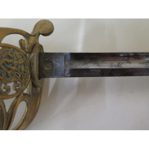 1074 - A Victorian naval sword and scabbard, sword length 89cm, some pitting and wear consistent with age