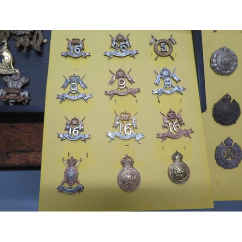 1077 - A collection of 85 military badges