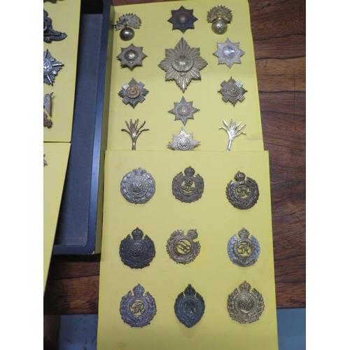 1077 - A collection of 85 military badges