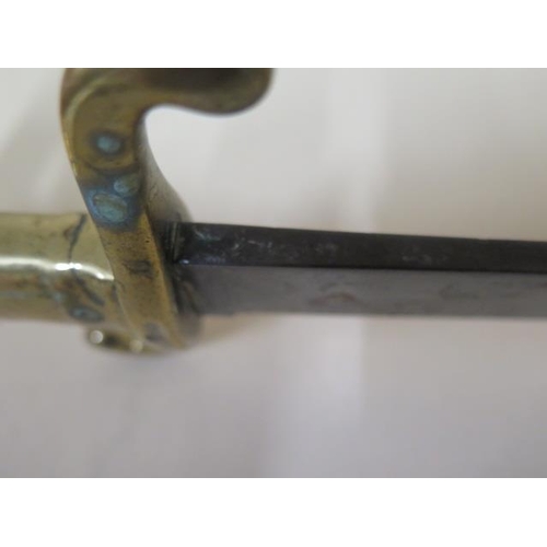 1079 - A 19th century hanger short sword with brass hilt, marked 76.A.4.31. with W and Crown 72 to blade, 5... 