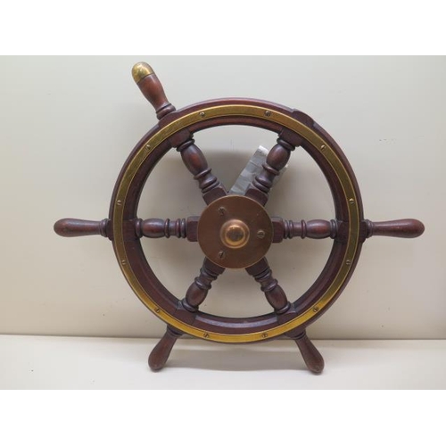 1088 - A WWII ships wheel with Admiralty label, 50cm wide, missing one piece