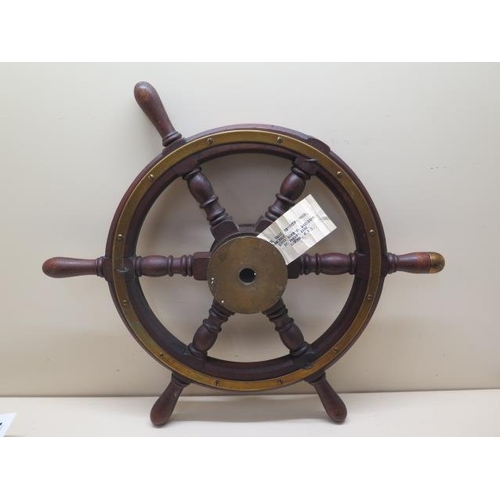 1088 - A WWII ships wheel with Admiralty label, 50cm wide, missing one piece