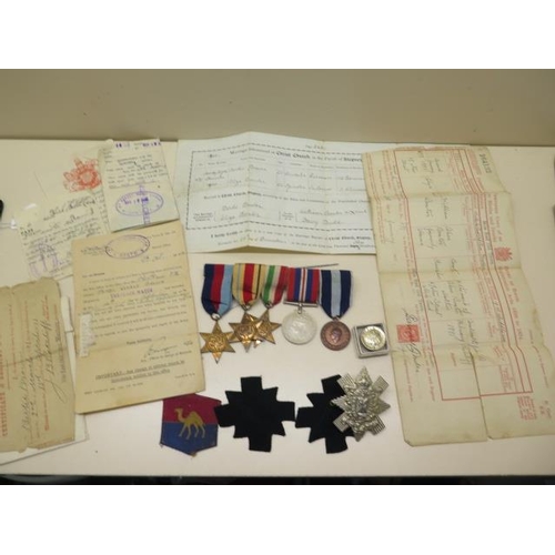 1090 - A group of WWII medals (unnamed) and various documents, badges relating to Pte James Roland Brown 97... 