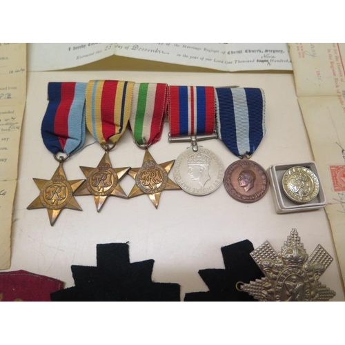 1090 - A group of WWII medals (unnamed) and various documents, badges relating to Pte James Roland Brown 97... 