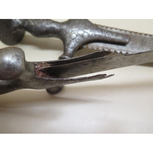 1096 - Two Indian Talwar swords, one with serrated blade, 93cm and 85cm long, both with pitting and some we... 