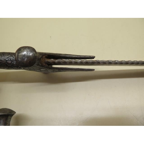 1096 - Two Indian Talwar swords, one with serrated blade, 93cm and 85cm long, both with pitting and some we... 