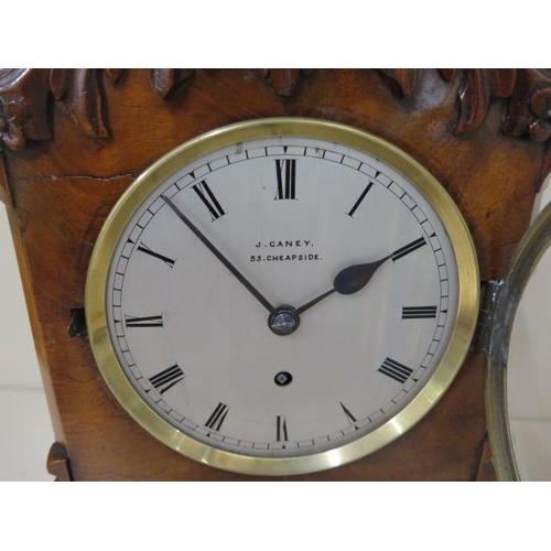 202 - An 8 day walnut table clock by J.Caney Cheapside London with a fusee movement, 33cm tall, running, s... 