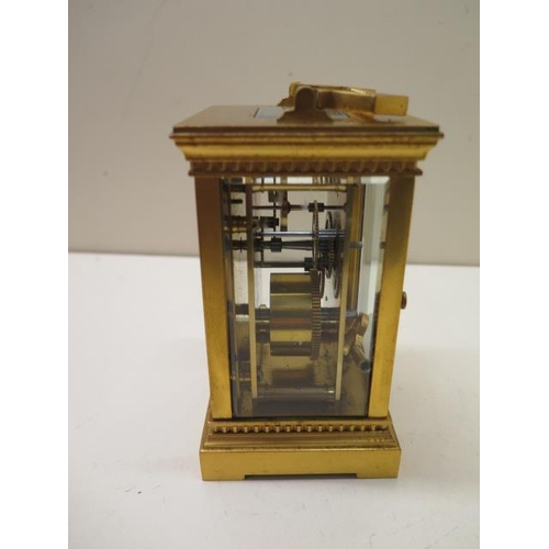 203 - An early 20th century gilt brass carriage clock, 16cm high including handle, running, glass good