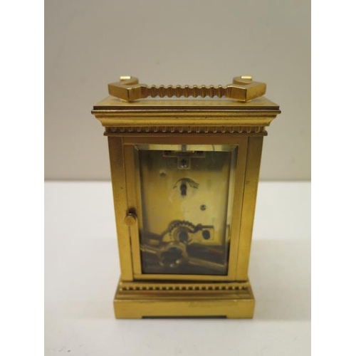 203 - An early 20th century gilt brass carriage clock, 16cm high including handle, running, glass good