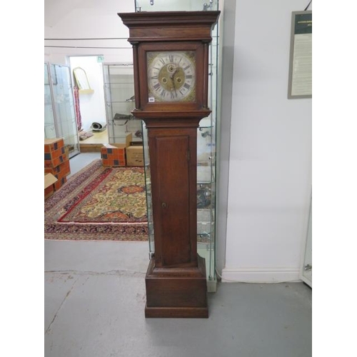 204 - An oak 8 day striking longcase clock with an 11