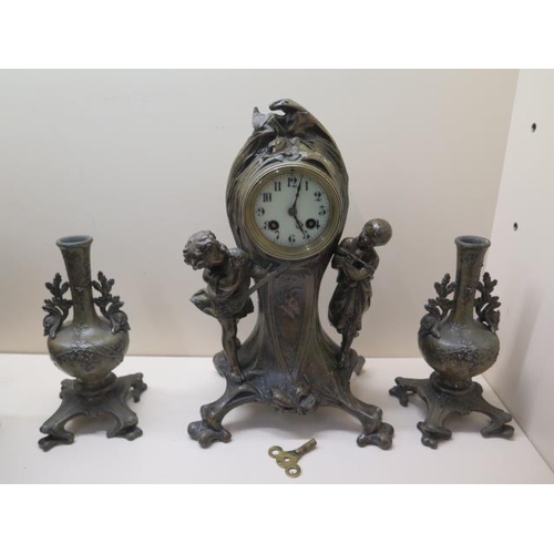 205 - An Art Noveau style three piece garniture 8 day movement, strikes on bell, 38cm tall, with key, repl... 