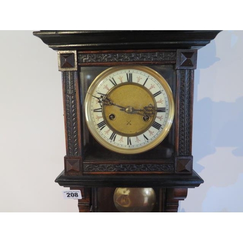 208 - An 8 day Austrian wallclock, strikes hours and half hours, 70cm tall with key, running