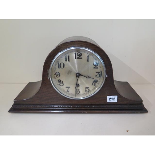 212 - An early 20th century mantle clock oakcase with Westminster chimes, 23cm tall, in running order