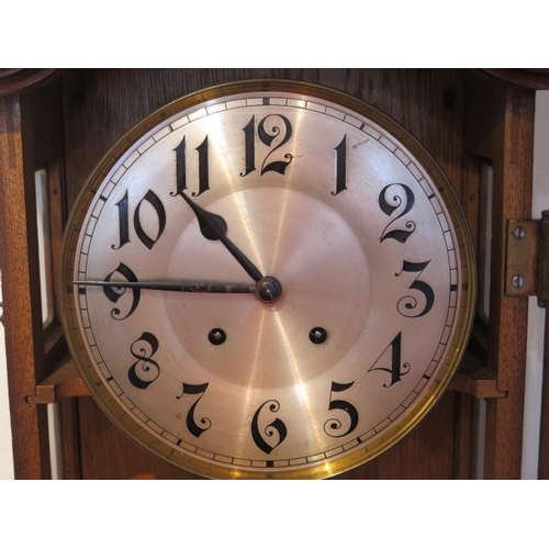 213 - An early 20th century oakcase wallclock, 8 day strikes hours/half, 87cm tall, in running order