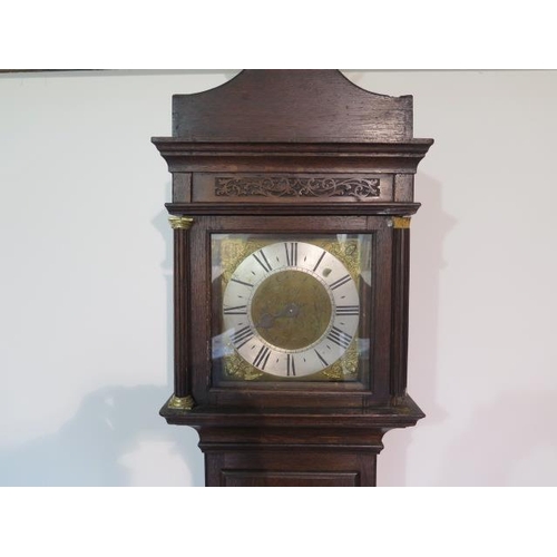 217 - An oak carved 30 hour single hand longcase clock, the dial signed Wm Russell Wootton, with a 8