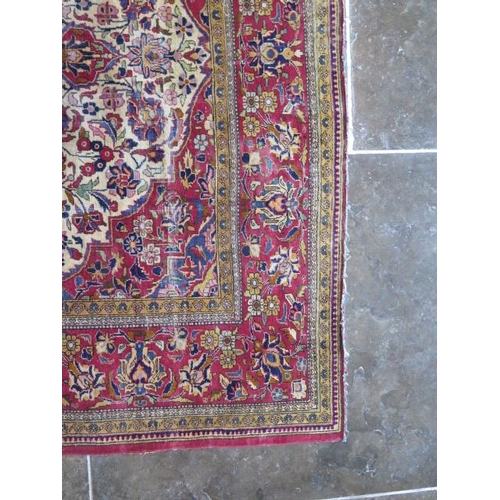 251 - A worn but decorative machine woven rug, 200cm x 128cm