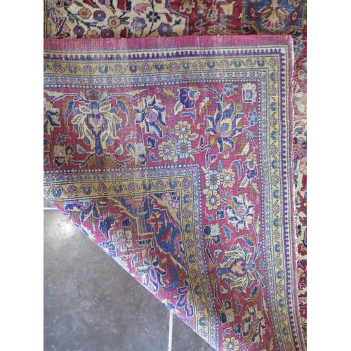 251 - A worn but decorative machine woven rug, 200cm x 128cm