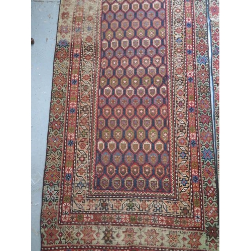 253 - A pair of hand knotted Persian runners, late 19th/early 20th century, red ground with geometric grad... 