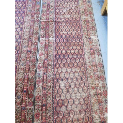 253 - A pair of hand knotted Persian runners, late 19th/early 20th century, red ground with geometric grad... 