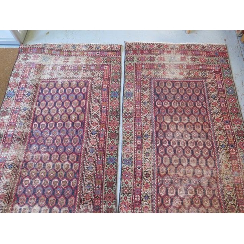 253 - A pair of hand knotted Persian runners, late 19th/early 20th century, red ground with geometric grad... 